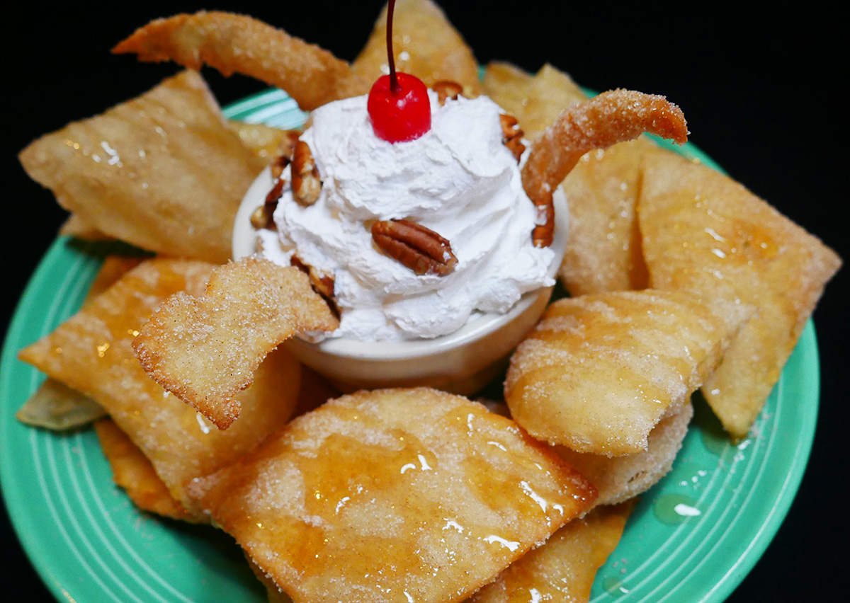 Sopapillas with whipped cream and honey